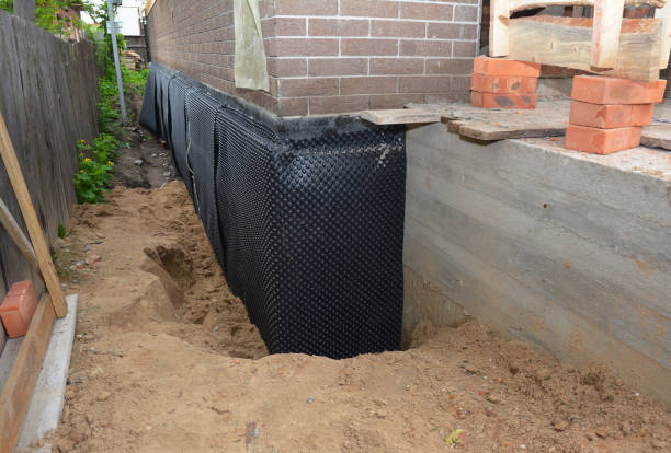 Happy homeowners after waterproofing job in La Follette